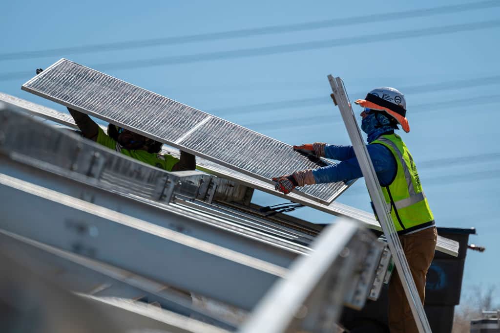 Contractors install solar panels at the Phillips 66 Rodeo Renewable Energy Complex in Rodeo, California, US, on Wednesday, July 31, 2024. Phillips 66's San Francisco refinery, which for years manufactured products like gasoline and jet fuel, is now producing only renewable fuels and is partially powered by solar energy. Photographer: David Paul Morris/Bloomberg via Getty Images